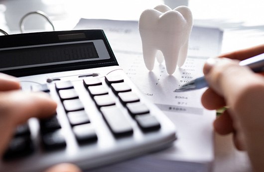 A patient attempting to calculate the cost of teeth whitenings