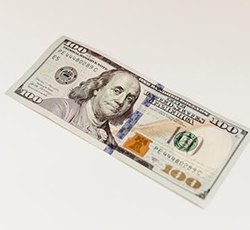 $100 bill on white background