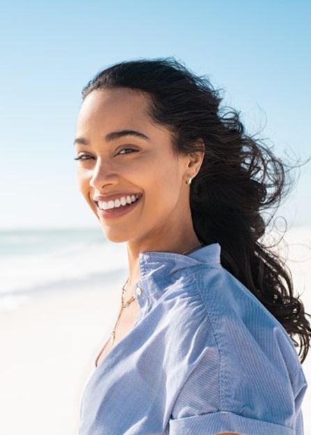 Lady smiles on beach?